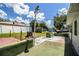 View of the backyard featuring a spacious patio and partially fenced yard at 1720 Park Dr, Lakeland, FL 33803