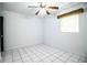 Bedroom features tiled flooring, a ceiling fan, and a closet at 1720 Park Dr, Lakeland, FL 33803