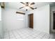 Bedroom has tile floors, a ceiling fan, and a closet at 1720 Park Dr, Lakeland, FL 33803