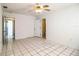 Bright bedroom offers tile flooring and convenient access to an ensuite bathroom at 1720 Park Dr, Lakeland, FL 33803