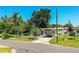 Charming single-story home featuring a covered carport and white picket fence at 1720 Park Dr, Lakeland, FL 33803
