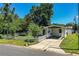 Charming single-story home featuring a covered carport and white picket fence at 1720 Park Dr, Lakeland, FL 33803