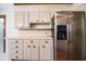 Bright kitchen showcasing updated appliances, white cabinets, and tile countertops at 1720 Park Dr, Lakeland, FL 33803