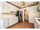 Classic kitchen features bright cabinets, tiled backsplash, and stainless steel refrigerator at 1720 Park Dr, Lakeland, FL 33803