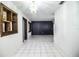 Modern living room featuring tile floors and decorative ceiling light fixture at 1720 Park Dr, Lakeland, FL 33803
