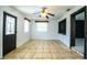 Spacious living room with tile floors, bright windows, and convenient access to the entry door at 1720 Park Dr, Lakeland, FL 33803