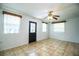 Inviting living room featuring tile floors, an entry door, and windows with natural light at 1720 Park Dr, Lakeland, FL 33803