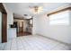 The light and airy living room showcases the hardwood floors and updated ceiling fan at 1720 Park Dr, Lakeland, FL 33803