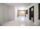 Open living room with tile floors and a view through to the adjacent rooms at 1720 Park Dr, Lakeland, FL 33803