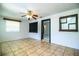 Bright living room featuring tile floors, large windows, and an open floor plan at 1720 Park Dr, Lakeland, FL 33803
