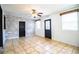 Open living room boasting tile floors, and a statement shiplap accent wall at 1720 Park Dr, Lakeland, FL 33803