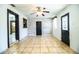 The light and airy living room showcases the hardwood floors and updated ceiling fan at 1720 Park Dr, Lakeland, FL 33803