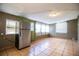 Neutral room with tile flooring, refrigerator, and natural lighting at 1720 Park Dr, Lakeland, FL 33803