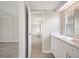 Bright bathroom with white cabinets, marble countertop, modern fixtures and new flooring at 2055 S Floral Ave # 245, Bartow, FL 33830