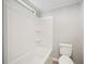 Clean white tub and shower combination in a well-maintained bathroom with a toilet at 2055 S Floral Ave # 245, Bartow, FL 33830