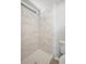 Bathroom featuring tiled shower with updated fixtures and neutral walls at 2055 S Floral Ave # 245, Bartow, FL 33830