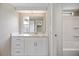 Updated bathroom features a white vanity with marble countertop, tub and shower combination at 2055 S Floral Ave # 245, Bartow, FL 33830