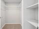 Walk-in closet with wire shelving and neutral carpet at 2055 S Floral Ave # 245, Bartow, FL 33830