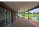Spacious covered patio offering stunning lake views and seamless indoor-outdoor living at 2055 S Floral Ave # 245, Bartow, FL 33830