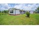 Charming home with well-maintained lawn and lake views, offering a serene and inviting atmosphere at 2055 S Floral Ave # 245, Bartow, FL 33830