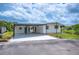 Charming single-story home featuring a carport and well-maintained landscaping at 2055 S Floral Ave # 245, Bartow, FL 33830