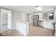 Updated kitchen featuring stainless steel appliances, white cabinetry, and modern finishes at 2055 S Floral Ave # 245, Bartow, FL 33830