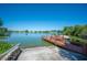 Scenic lake view featuring a private boat dock, lush greenery, and tranquil waterfront living at 2055 S Floral Ave # 245, Bartow, FL 33830