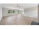 Bright and airy living room featuring modern floors, neutral walls, and outdoor views at 2055 S Floral Ave # 245, Bartow, FL 33830