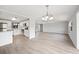 Open floor plan with modern kitchen and living area featuring hardwood floors at 2055 S Floral Ave # 245, Bartow, FL 33830