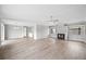 Spacious living room with modern flooring, neutral paint, and fireplace feature at 2055 S Floral Ave # 245, Bartow, FL 33830