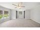 Spacious main bedroom with neutral carpet and lots of closet space and lake views at 2055 S Floral Ave # 245, Bartow, FL 33830