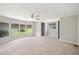 Spacious main bedroom with neutral carpet, ceiling fan and serene views of the lake at 2055 S Floral Ave # 245, Bartow, FL 33830