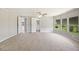 Bright main bedroom with neutral carpet, ceiling fan and serene views of the lake at 2055 S Floral Ave # 245, Bartow, FL 33830