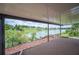 Covered patio overlooking a tranquil lake, offering a relaxing outdoor space with scenic views at 2055 S Floral Ave # 245, Bartow, FL 33830