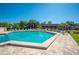 Inviting community pool with clear blue water and comfortable lounge seating, surrounded by lush landscaping at 2055 S Floral Ave # 245, Bartow, FL 33830