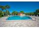 Relaxing community pool with sun loungers and vibrant blue water, perfect for enjoying sunny days at 2055 S Floral Ave # 245, Bartow, FL 33830