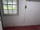 This basement corner shows white painted brick, and painted concrete floors at 2105 E Cherokee St, Bartow, FL 33830