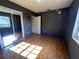 This bedroom features two windows, patterned flooring, space-themed decorations, and a closet at 2105 E Cherokee St, Bartow, FL 33830