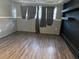 Bedroom featuring laminate wood floors, gray walls and black accent wall at 2105 E Cherokee St, Bartow, FL 33830