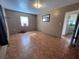 This bedroom features one window, patterned flooring, and a closet at 2105 E Cherokee St, Bartow, FL 33830
