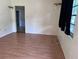 A simple bedroom showcasing durable floors and natural light at 2105 E Cherokee St, Bartow, FL 33830