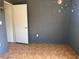 This bedroom features patterned flooring, space-themed decorations, and an open closet at 2105 E Cherokee St, Bartow, FL 33830