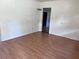 A simple bedroom showcasing durable floors and natural light at 2105 E Cherokee St, Bartow, FL 33830