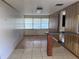 Bonus room featuring tile and faux wood flooring, bright light and wood accents at 2105 E Cherokee St, Bartow, FL 33830