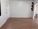 A bright, empty living room with durable flooring and neutral walls at 2105 E Cherokee St, Bartow, FL 33830