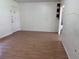 A bright, empty living room with durable flooring and neutral walls at 2105 E Cherokee St, Bartow, FL 33830