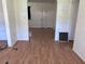 Spacious living room showcasing durable floors and an entryway to another room at 2105 E Cherokee St, Bartow, FL 33830
