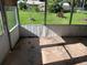 Screened-in back porch with a view of the yard at 2105 E Cherokee St, Bartow, FL 33830