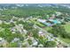 An aerial view shows the home's proximity to nearby community pool and amenities at 215 W Valencia St, Lakeland, FL 33805