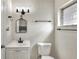 A modern bathroom features a stylish mirror, vanity, and fixtures at 215 W Valencia St, Lakeland, FL 33805